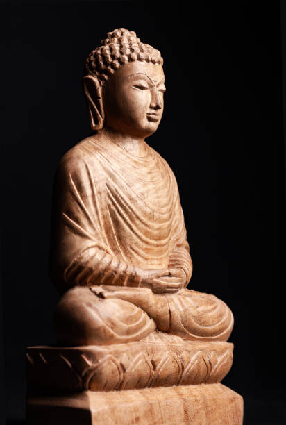 istock Buddha in a meditation pose, made of wood. 1167532282