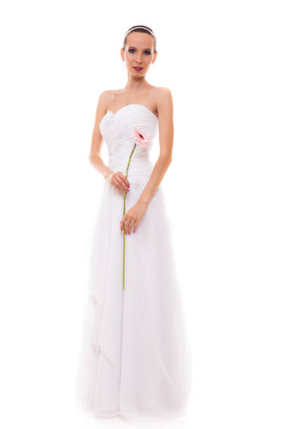istock Full length bride in white wedding gown isolated 1167533359