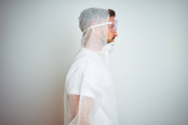 istock Painter man wearing professional worker equipment protection over isolated background looking to side, relax profile pose with natural face with confident smile. 1167533861