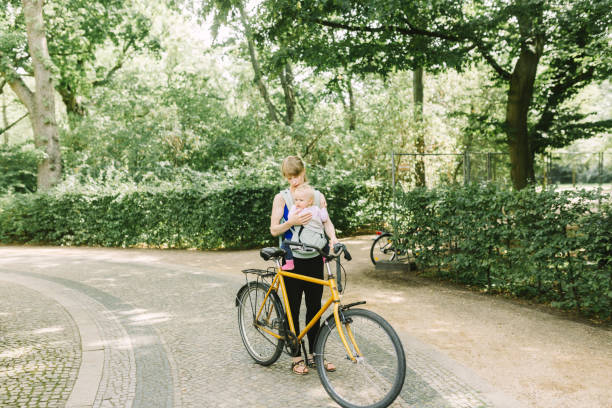 istock Young mother commuting with her baby through the park 1167534664