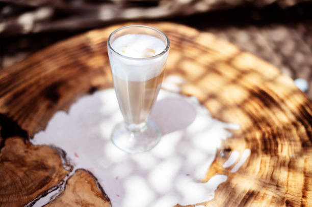 istock Coffee cafe latte macchiato outdoors on a rustic wooden table 1167535376