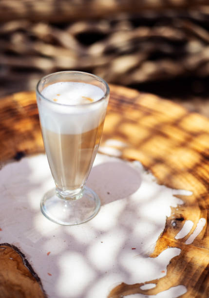 istock Coffee cafe latte macchiato outdoors on a rustic wooden table 1167536485