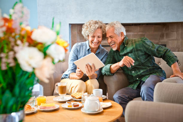 istock Cheerful retired couple sharing digital tablet 1167536585
