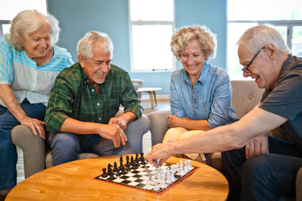 istock Elderly men with friends playing chess at home 1167537998