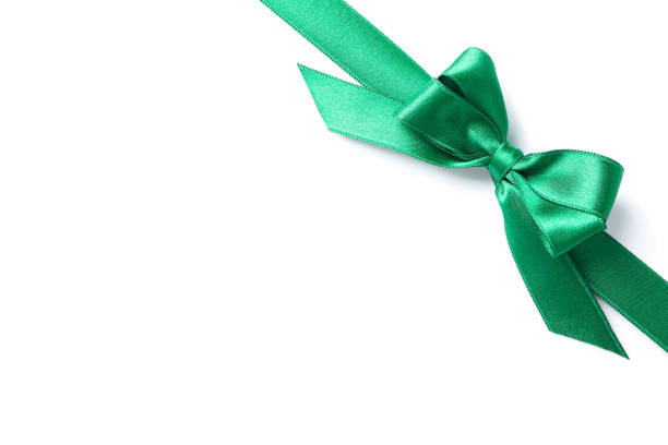 istock Green ribbon with bow isolated on white background. Gift concept 1167538974