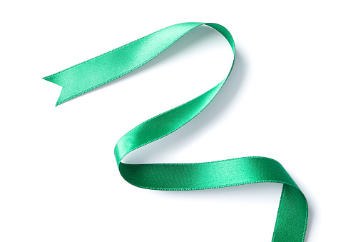 Green ribbon isolated on white background. Gift concept