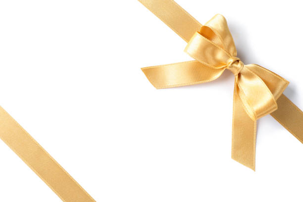 istock Golden ribbons with bow isolated on white background. Gift concept 1167539189