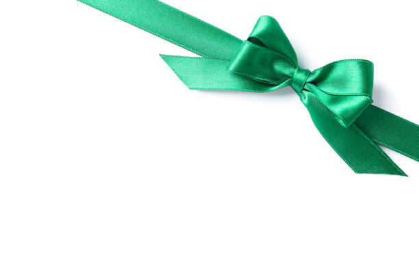 istock Green ribbon with bow isolated on white background. Gift concept 1167539344