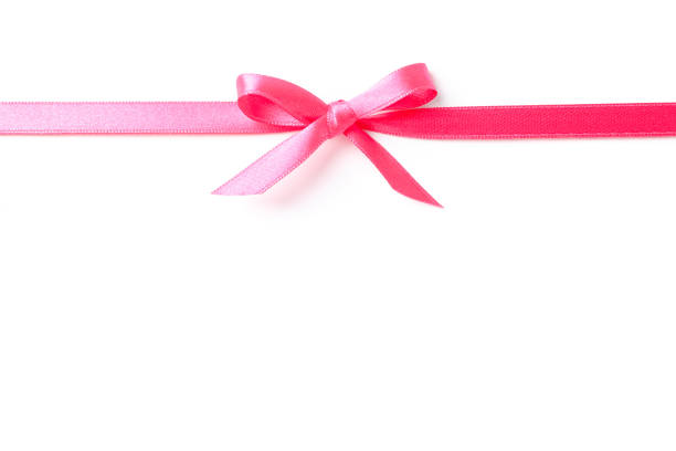 istock Pink ribbon with bow isolated on white background. Gift concept 1167539391