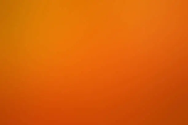 Photo of Abstract background of caramel and chocolate texture. Orange and brown gradient