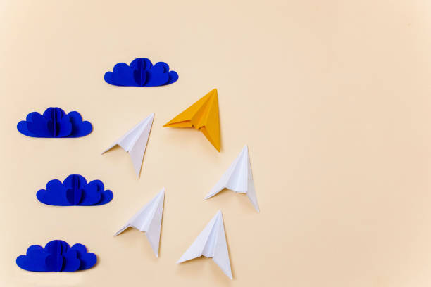 istock Origami clouds and paper planes representing leadership concept. Creative composition for banner/landing page/background. 1167540721