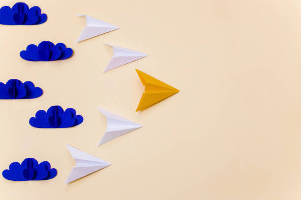 istock Origami paper planes and 3d clouds for leadership concept. Creative craft composition for banner/landing page/background. 1167540722
