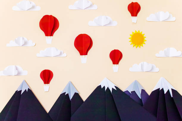 istock Origami mountain landscape with hot air balloons, 3d clouds and sun. Creative composition for banner/landing page/background 1167540815