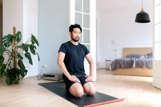 istock Asian man kneeling in seiza position at home 1167541015