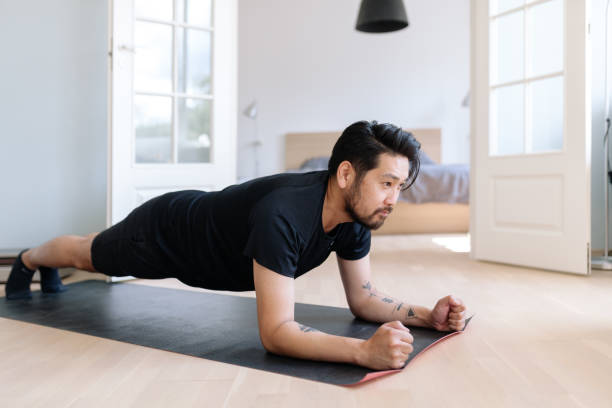 istock Asian man does planking exercise at home 1167541026