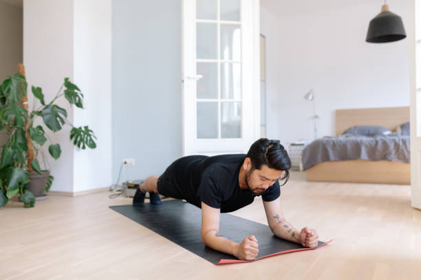 istock Asian man does planking exercise at home 1167541077