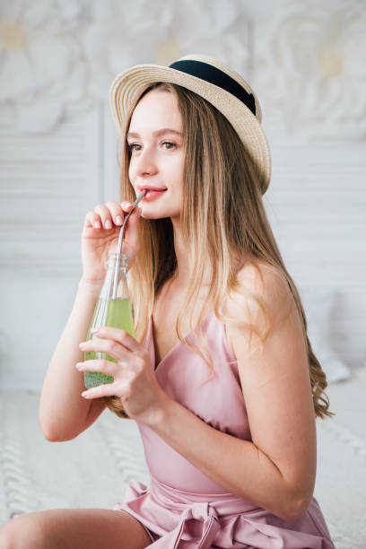 istock Girl drinks a healthy green drink with Basil seeds 1167541718