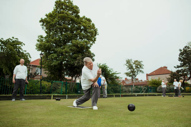 istock Focused Senior Woman Lawn Bowling 1167543989