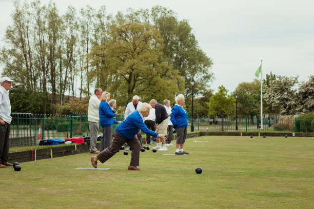 istock Senior Woman Bowling on Grass 1167544246