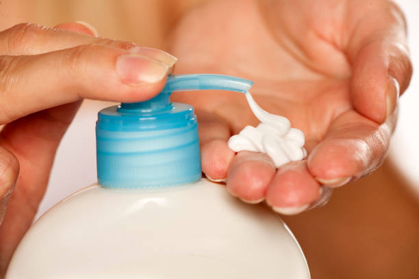 istock putting lotion on hand from the pump 1167548508