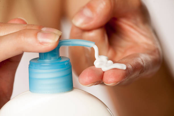 istock putting lotion on hand from the pump 1167548633