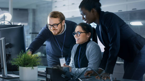 istock Diverse Team of Research Engineers Working in a high Tech Laboratory on a High Profile Start-up. Team Consists of Black and Caucasian Young Women and White Male. 1167549752