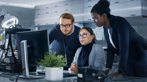 istock Diverse Team of Research Engineers Working in a high Tech Laboratory on a High Profile Start-up. Team Consists of Black and Caucasian Young Women and White Male. 1167549780