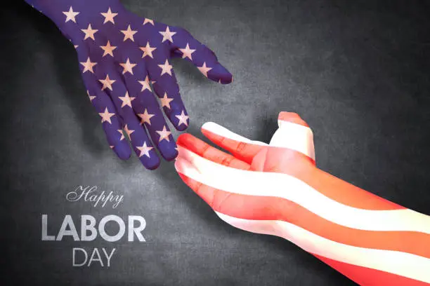 Two hands of people handshaking patterned with an American flag. Shot with Happy Labor Day text background