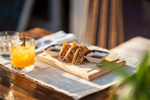 Tasty mexican tacos with cocktail