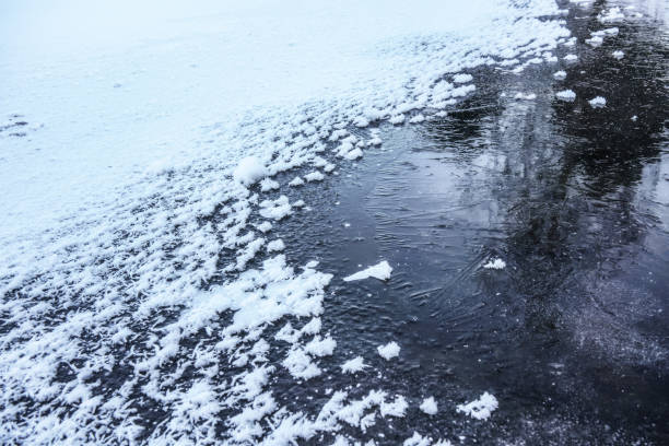 istock Ice on frozen pond, crystalline snow on top 1167550553