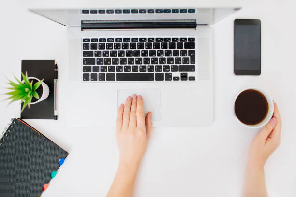 istock Female hands scrolling laptop touch pad . 1167550600