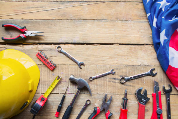 istock Handy tools and American flag on the wooden table 1167551340