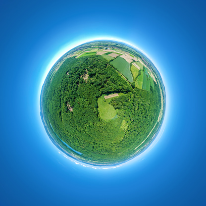 An image of a little planet rural fields and forest south Germany