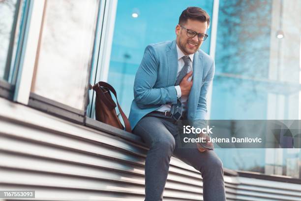 Businessman Having Heart Attack Stock Photo - Download Image Now - Heart Attack, Chest Pain, Working