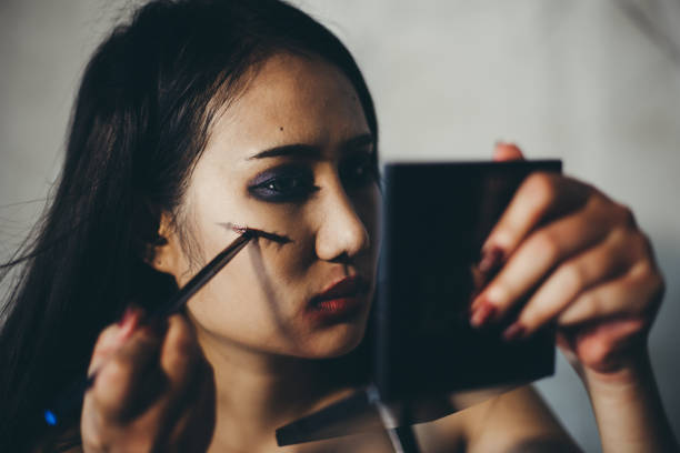 istock Young woman makeup on halloween night. 1167554840