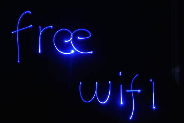 istock Free Wifi written with blue lights 1167556308