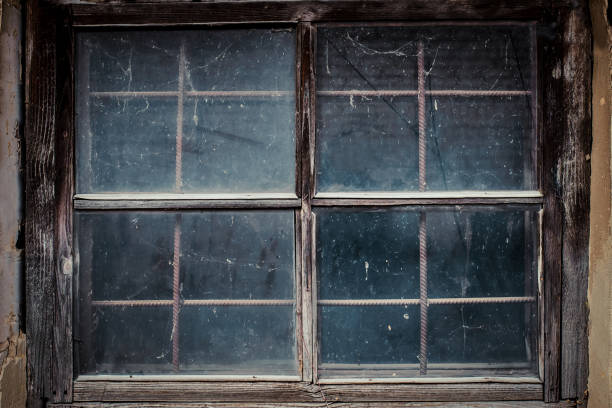 istock Dirty window in the old house shed 1167557132