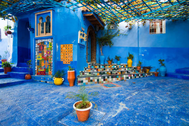 Decorated entrance into rustic riad in Chefchaouen in Morocco Chefchaouen, Morocco - November 19, 2017: Decorated entrance into rustic riad in Chefchaouen in Morocco chefchaouen photos stock pictures, royalty-free photos & images