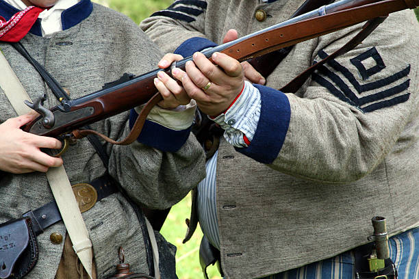 istock Civil War Weapons Training: Soldier Teaching Cadet to use Musket 116755761