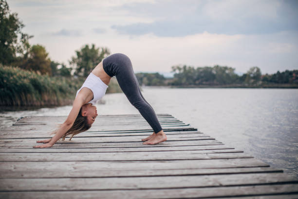 istock Woman training yoga alone 1167558452
