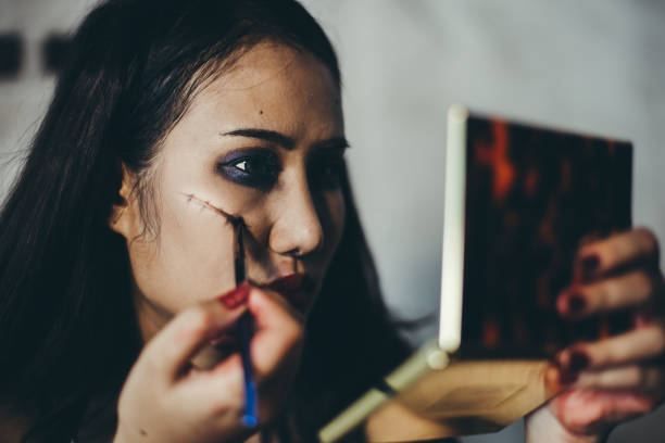 istock Young woman makeup on halloween night. 1167558820