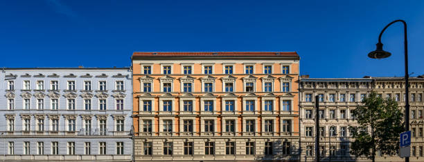 Impressive "Gruenderzeit" facades: listed row of houses in Berlin-Prenzlauer Berg - Panorama from 3 pictures stock photo
