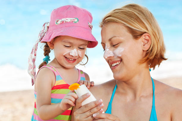 istock Child applying sunscreen on her mother's face 1167560158