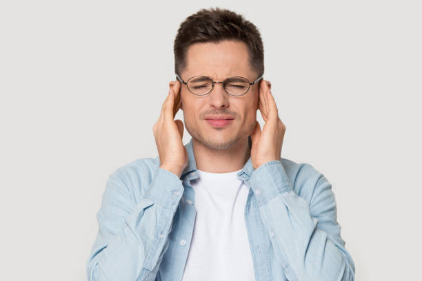 istock Head shot portrait stressed man touching temples suffers from headache 1167561011
