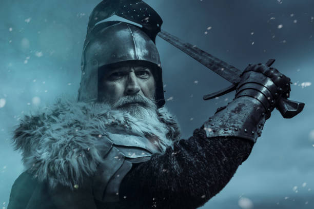 istock Senior knight  wearing traditional clothes with sword 1167562356