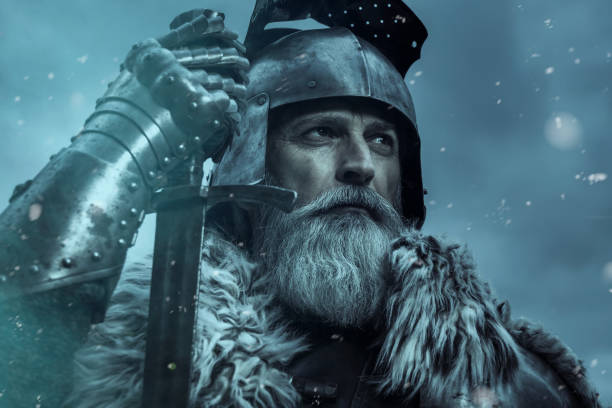 istock Senior knight  wearing traditional clothes with sword 1167562357