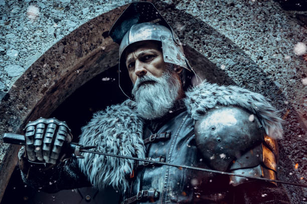 istock Senior knight  wearing traditional clothes with sword 1167562358