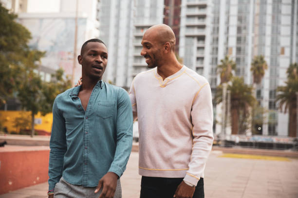 istock Handsome couple walking in downtown 1167564666
