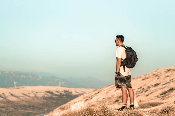 istock Young traveler enjoying the view on the hill 1167569803