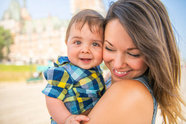 Mother with her baby son on a urban background